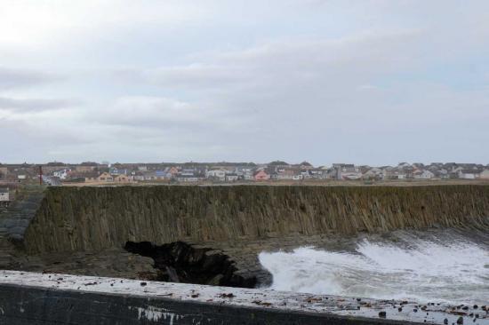 Photograph of Storms Smash Hole In Pier Wall At Wick Harbour